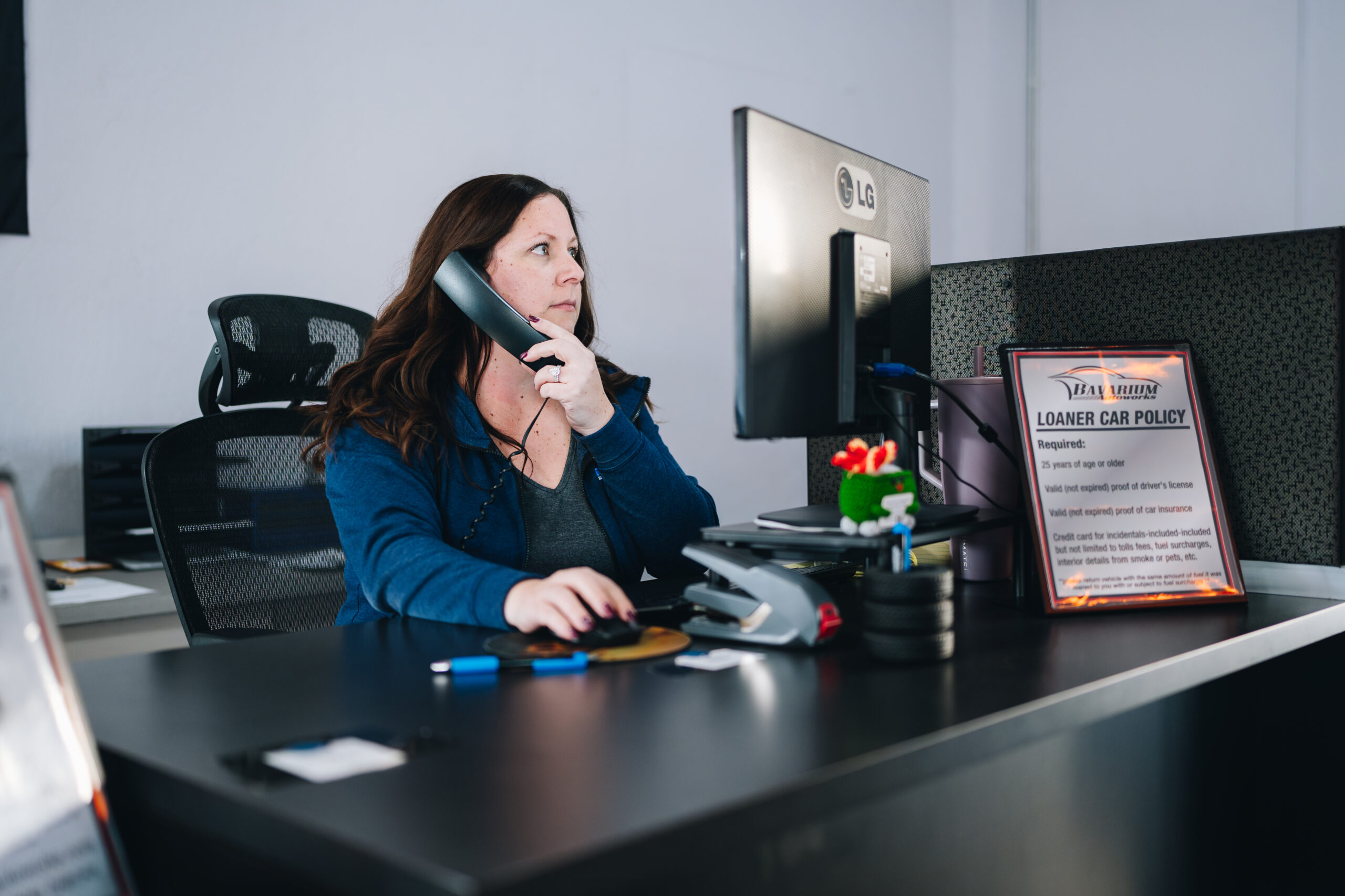 Administrative coordinator at Bavarium Autoworks answers phone calls, helping people book appointments for car repair in Mountain View, CA.